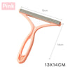 A pink portable lint and pet hair remover brush with a 13cm by 14cm size.