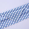 Blue and white striped cotton dog bandana folded and laid flat