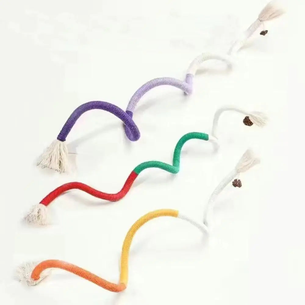 A collection of multi-colored cotton rope cat teaser toys with tassels, arranged diagonally on a white background.