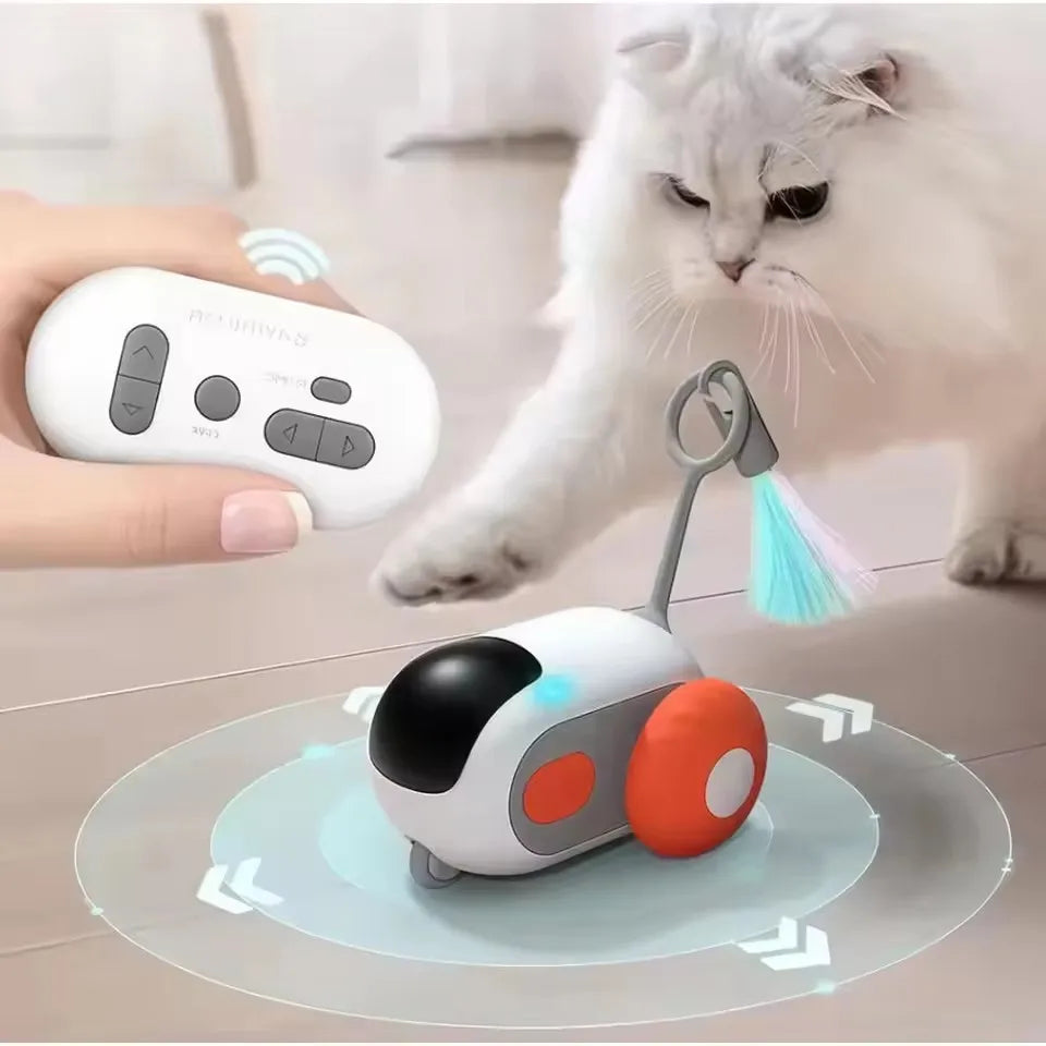 A white interactive automatic pet toy car is shown with a cat interacting with it.