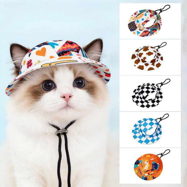 A fluffy white and brown cat wearing an orange patterned pet bucket hat