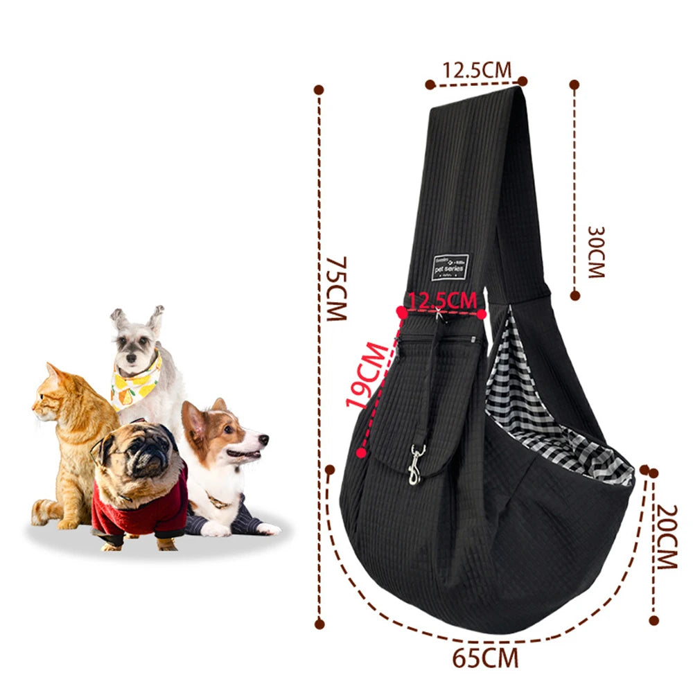 Black crossbody pet carrier bag shown next to a small dog and cat, with dimensions marked.