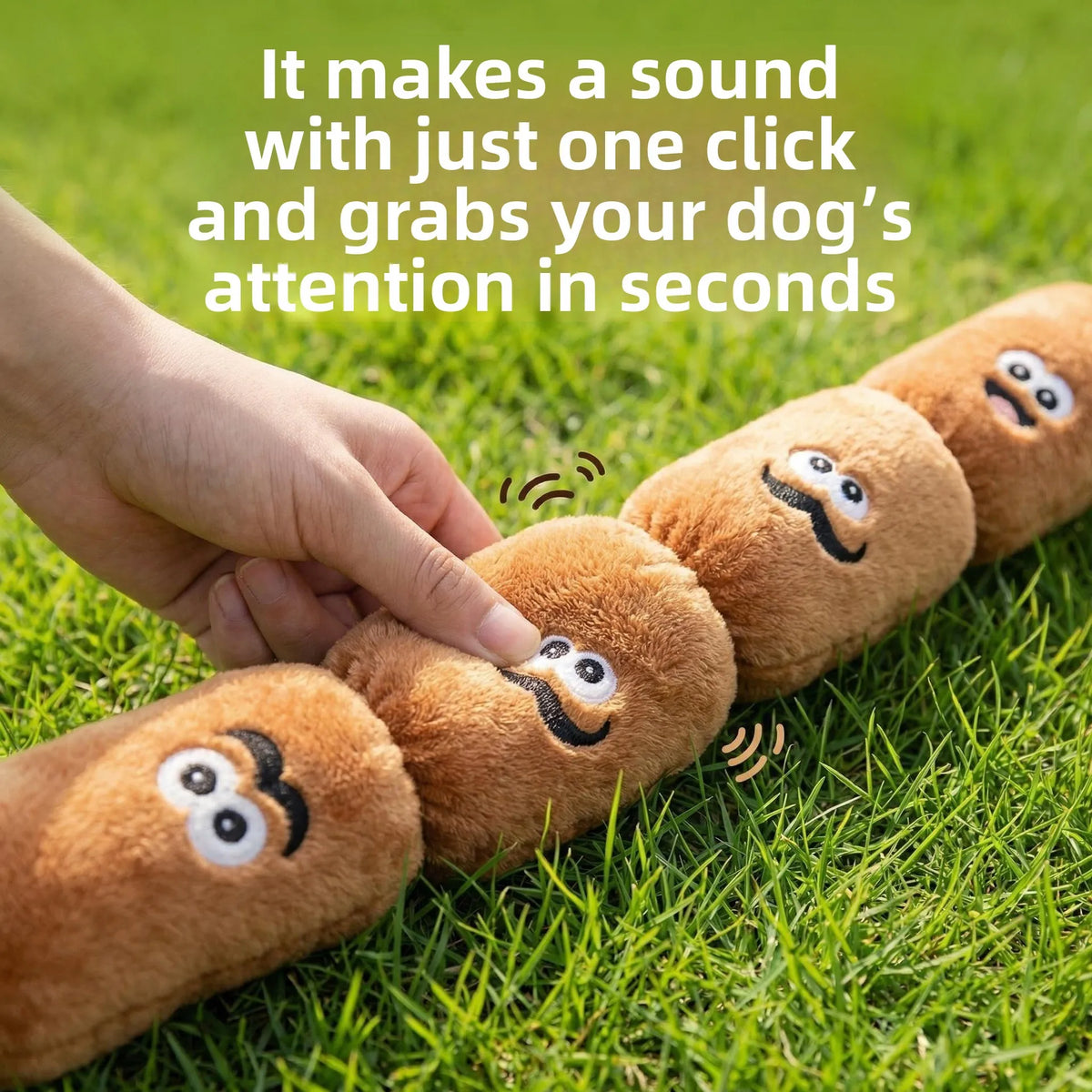 A hand is interacting with several brown squeaky dog chew toys lying on green grass.