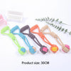 A collection of colorful cotton rope dog chew toys with various knots and textures displayed on a white background.