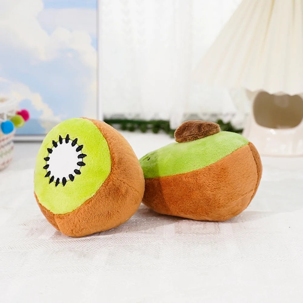 A plush toy shaped like an avocado and kiwi fruit, featuring green and brown colors.