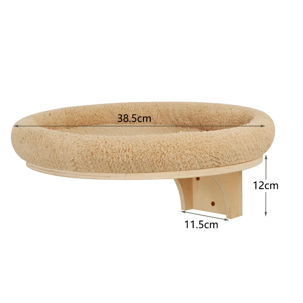 Wall-mounted cat climbing shelf with a hammock and scratching post, light beige color.