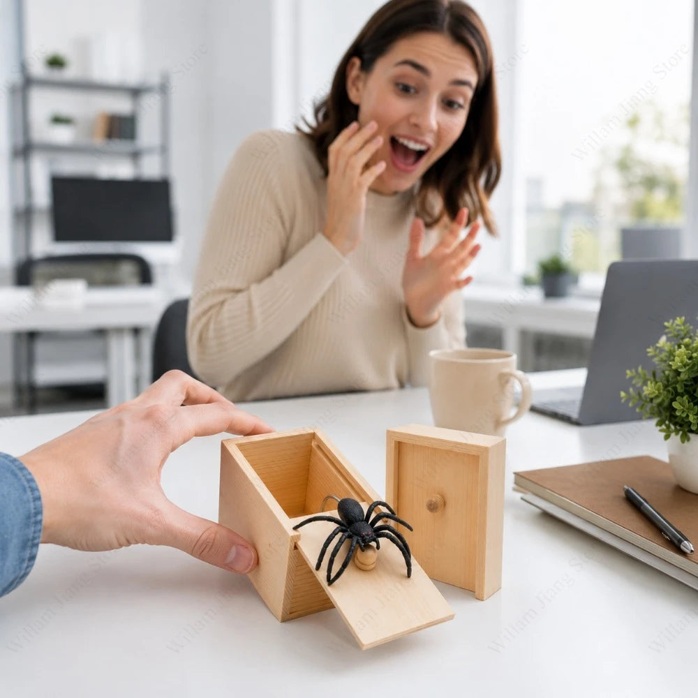 A hand is opening a wooden box containing a black spider for a surprise prank.