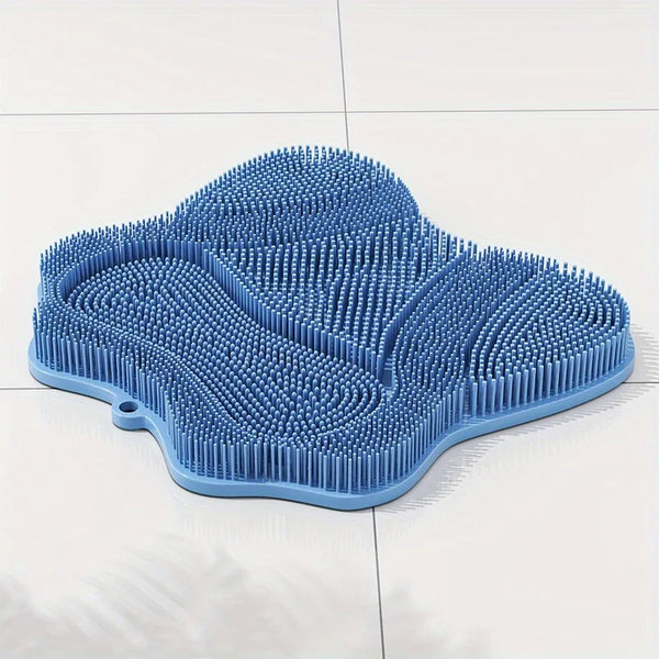 A light blue natural TPE cat grooming brush with dense, flexible bristles resting on a white surface.
