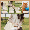 A woman is holding a beige quilted pet carrier bag with a fluffy white pom-pom, set against a green outdoor background.