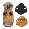 A tan quilted hooded dog jacket with a gray faux fur lining and black waterproof shell.