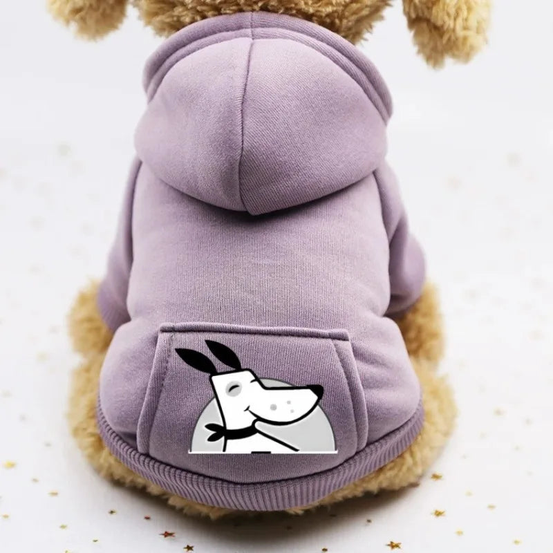 A purple cozy fleece dog sweatshirt with a hood and a pocket featuring a white silhouette of a dog's face.