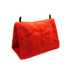 A bright red, quilted plush bird hammock tent with black strings.