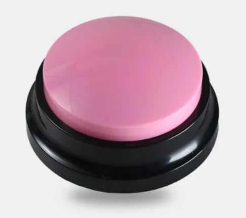 A pink recordable talking button for dog training with a black base.