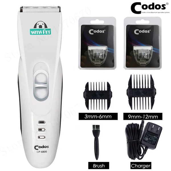 A white Codos pet hair trimmer with black bristles and a separate charger cable.