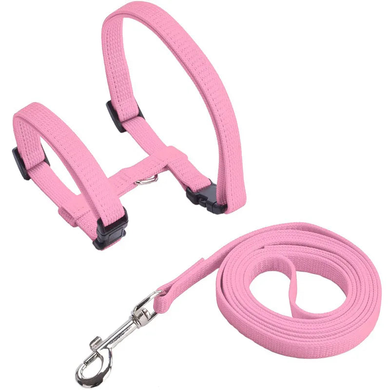 Pink adjustable nylon pet harness and leash set with a padded collar and silver clip