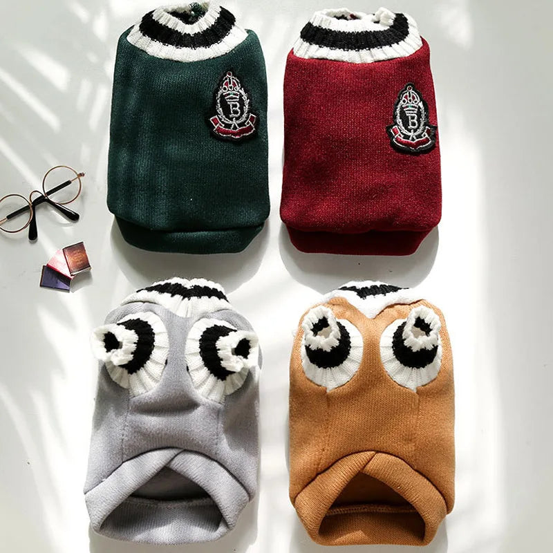 Three knitted vests for small dogs in dark green, maroon, and brown tones.